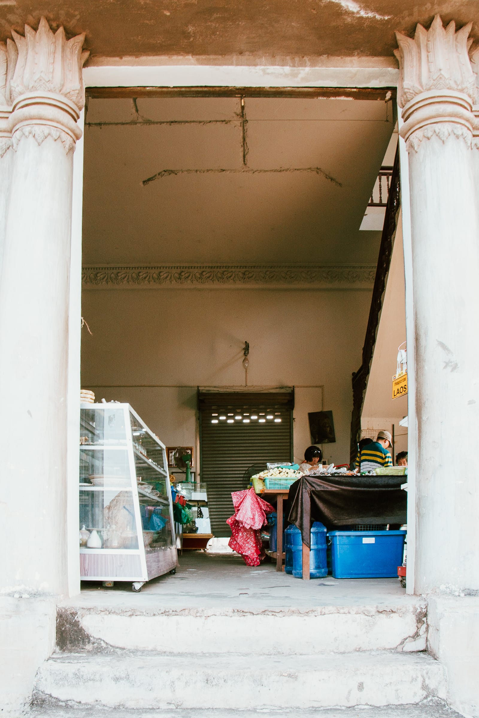 sellers inside patuxai monument in vientiane lao