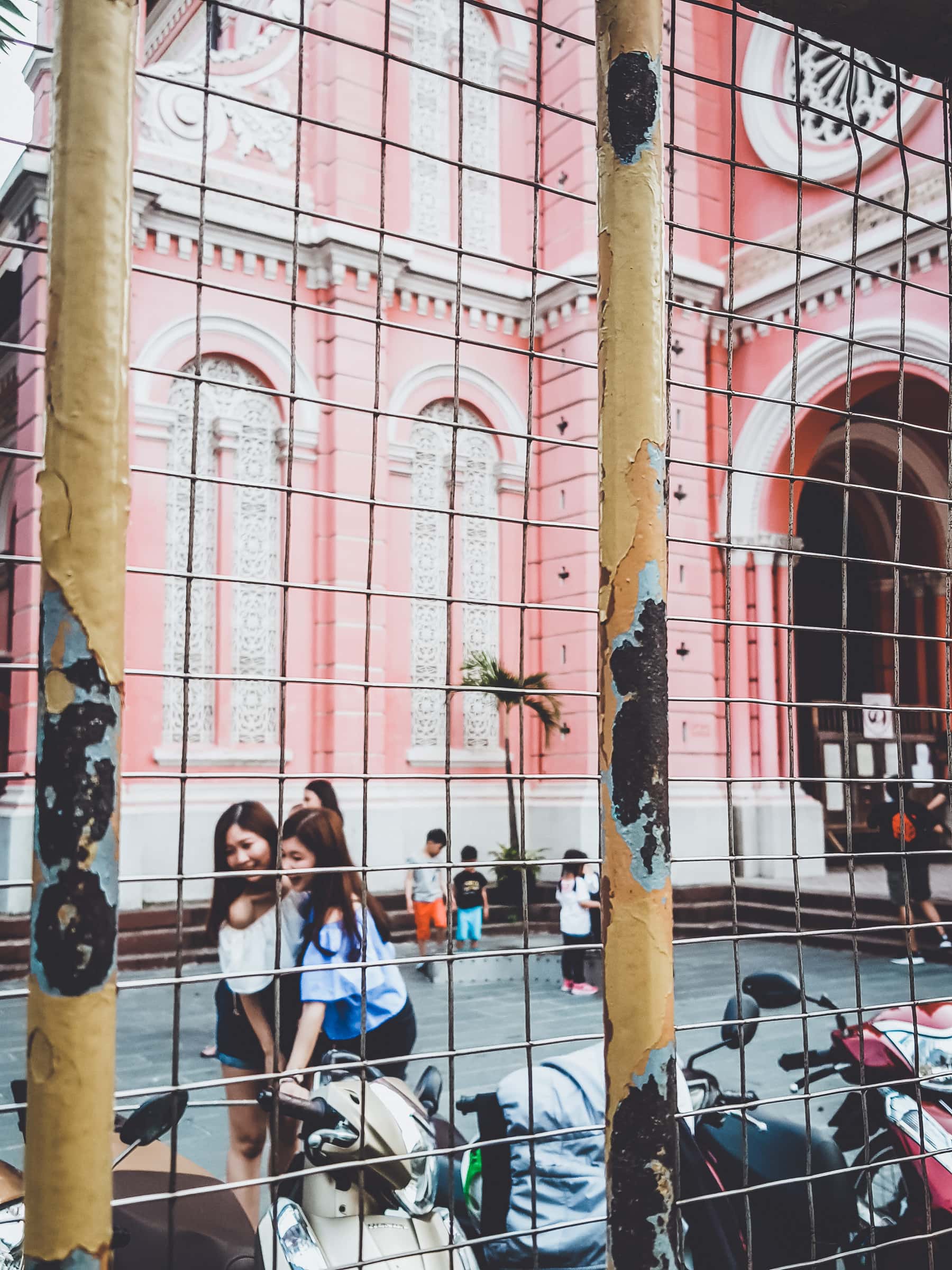 Girl in front of Pink Church, Ho Chi Minh City