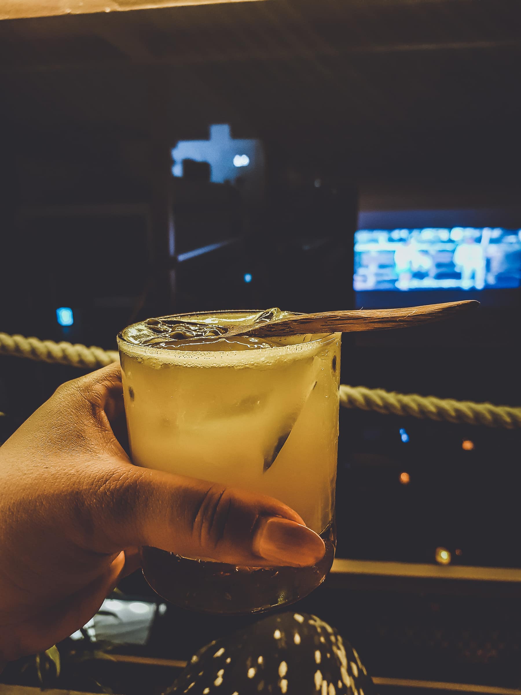 Caipifruta with passion fruit in rooftop bar in Saigon Vietnam