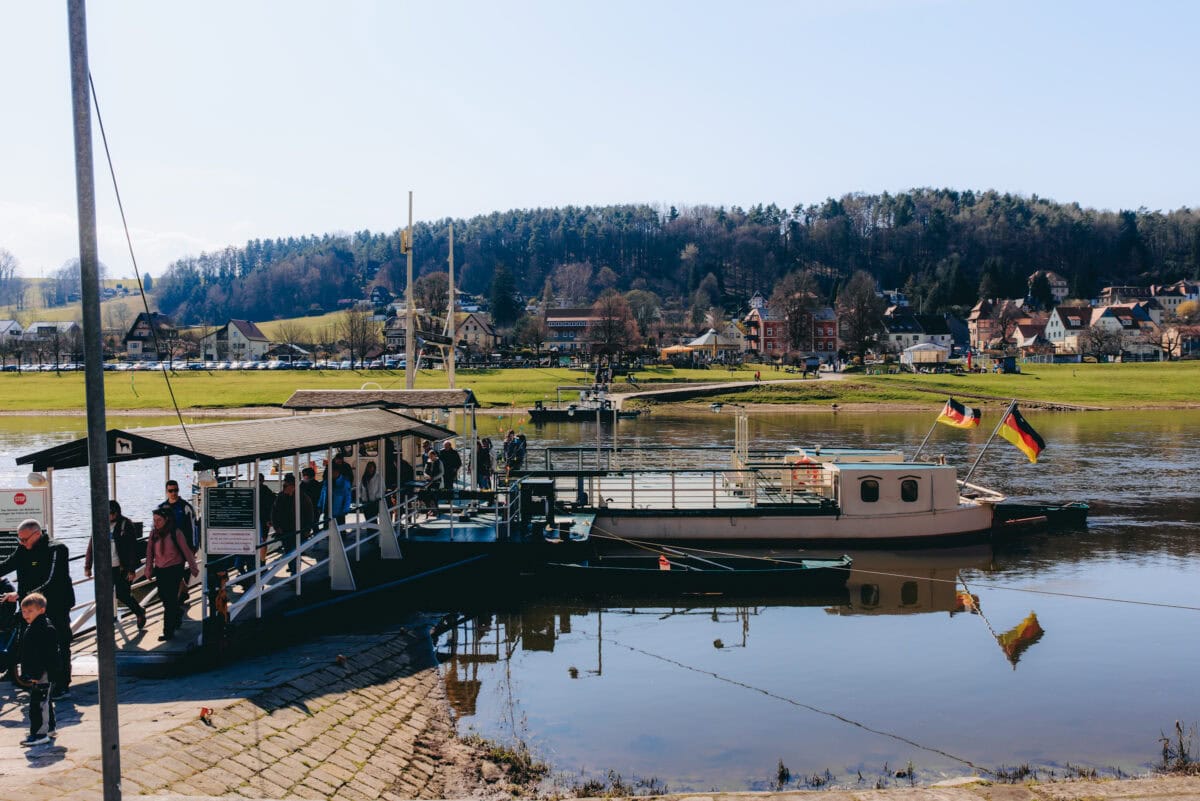 Ferry with German flags on the riverbank