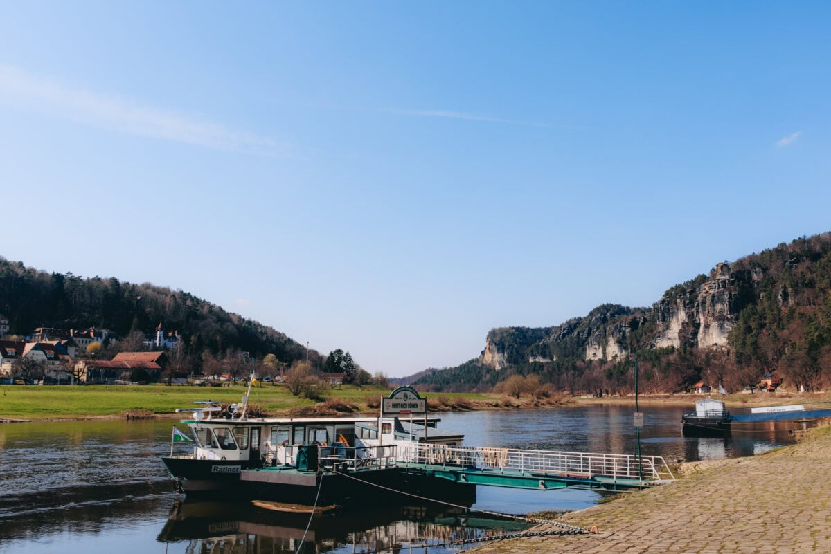 Ferry on the Elbe in Rathen in front of a rocky landscape
