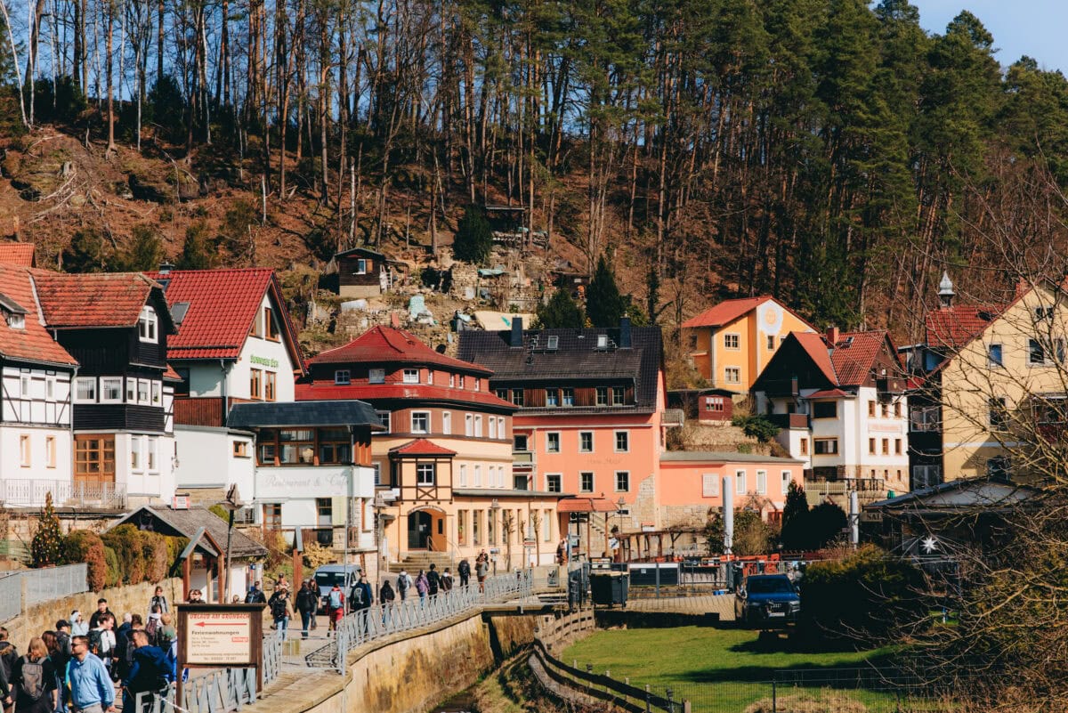 Colorful village with half-timbered houses on the edge of the forest
