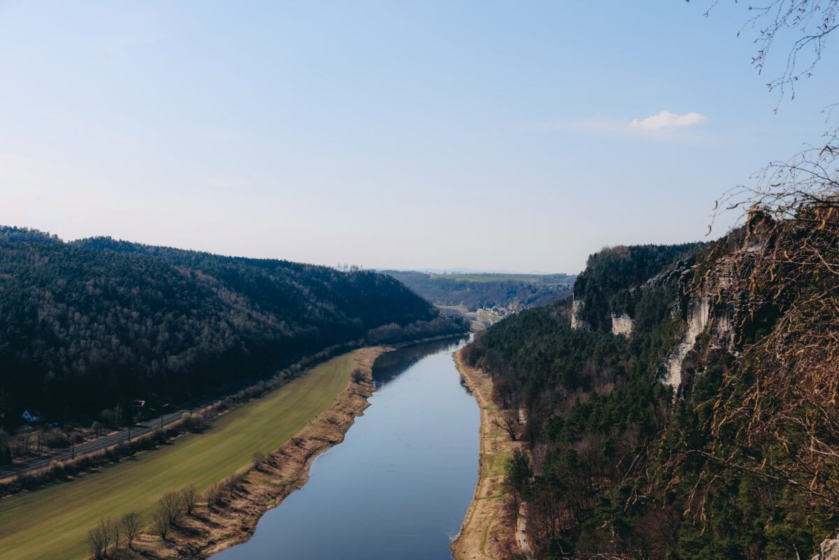 River valley with rocks and wooded hills