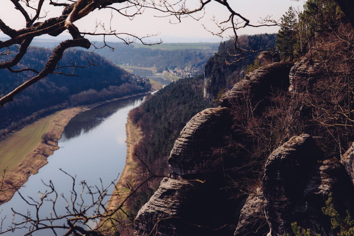 River winds through valley with rocks