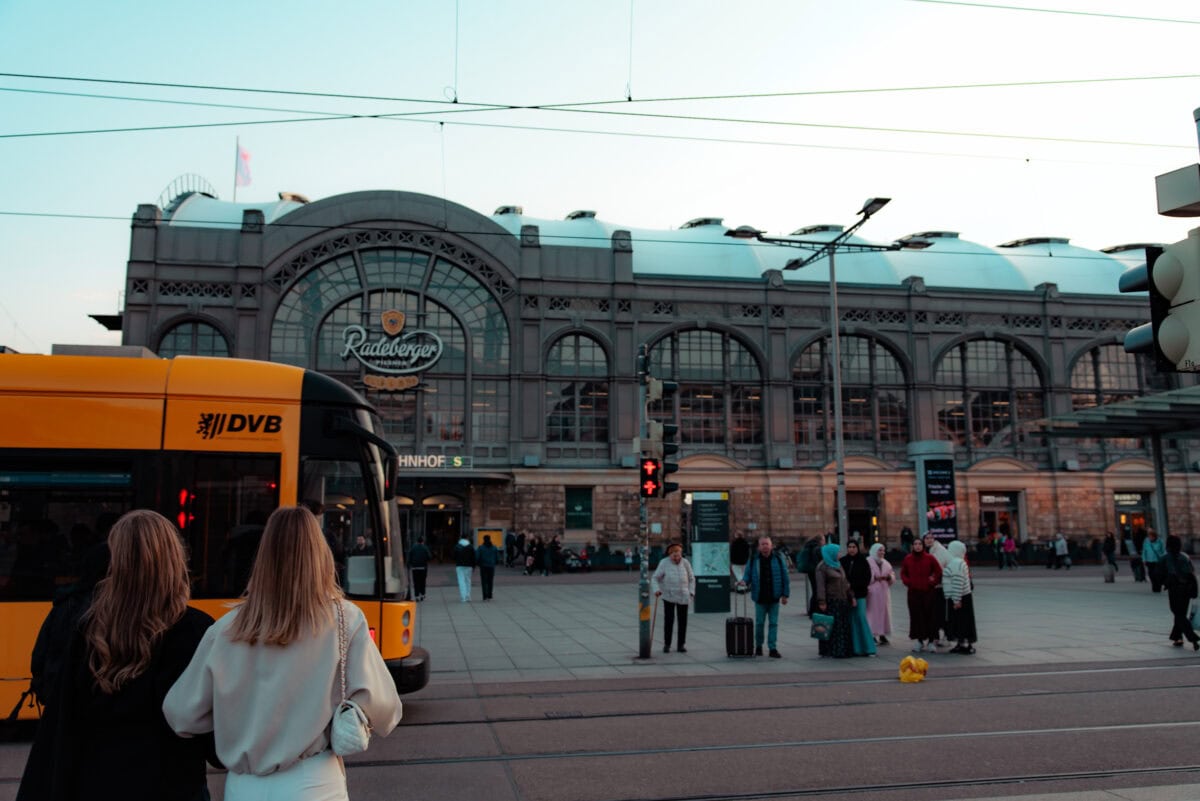 Dresden main station with streetcar and passers-by
